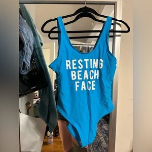 Blue “resting beach face” customized one piece bathing suit